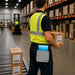Warehouse worker carrying a Unitech RT112 tablet in a gray Agoz waist belt case while handling inventory