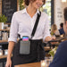 Restaurant server wearing a gray Agoz crossbody holster with Stripe Reader during tableside service