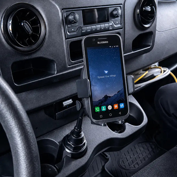 Bluebird mobile computer mounted in a cup holder cradle inside a work truck vehicle
