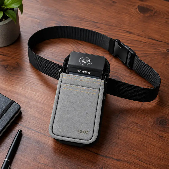 Castles handheld POS terminal in gray Agoz holster with waist belt on tabletop