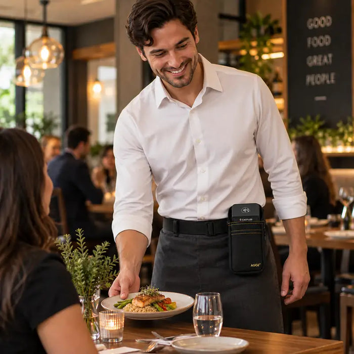 Server wearing black Agoz waist belt holster with Castles POS terminal in restaurant