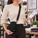 Retail employee carrying Clover Flex POS terminal with Agoz shoulder sling holster