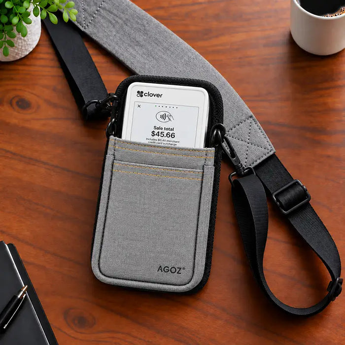 Gray Agoz Clover Flex POS sling holster with adjustable shoulder strap on work surface
