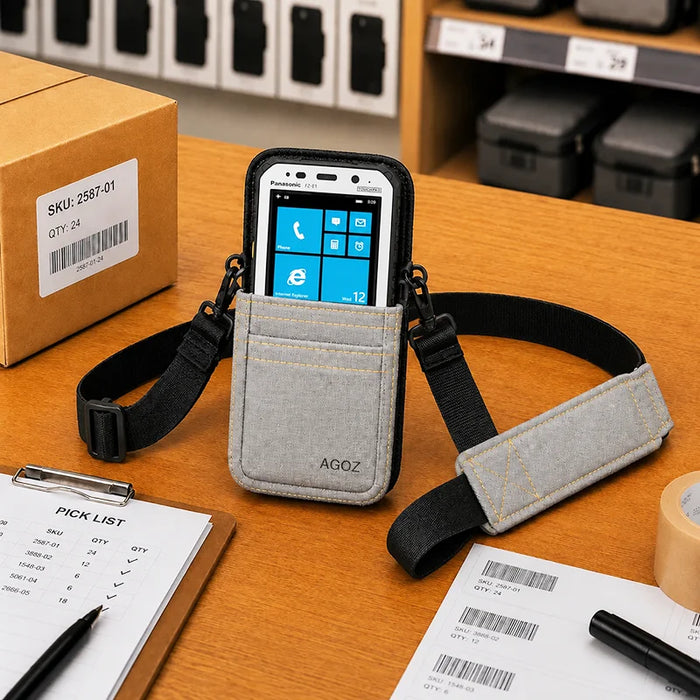 Gray Panasonic Toughbook shoulder sling holster with device displayed in pouch on a retail packing workstation.