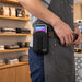 Close-up of Agoz belt clip case securely holding Stripe Reader payment terminal at a worker’s waist
