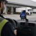 Bluebird handheld computer in a dashboard cradle mount used in a commercial fleet vehicle