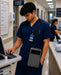 Nurse with honeywell tablet case using a computer in a hospital setting