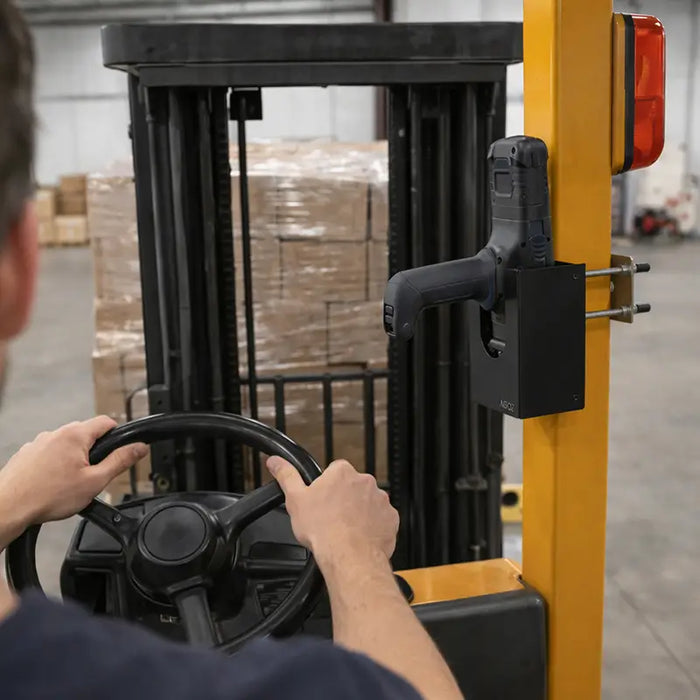 Forklift operator with Honeywell CK65 scanner mounted in AgozTech metal holder on forklift pillar