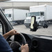 Chainway mobile scanner mounted on a delivery vehicle windshield using an AgozTech cradle holder at a warehouse loading dock.