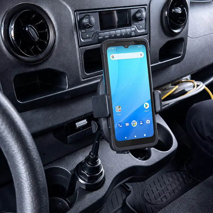 Unitech mobile scanner secured in an AgozTech cup holder vehicle cradle mount inside a commercial vehicle console.